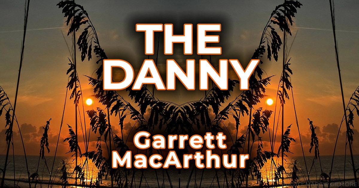 THE DANNY - Garrett MacArthur (image of a mirrored sunrise over the ocean through sea grass, resembling a mysterious alien face)